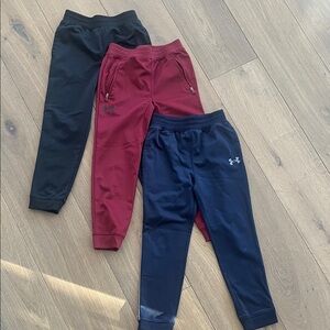 3 pairs size 6 boys under armour joggers.